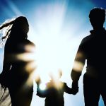 man and woman holding hands